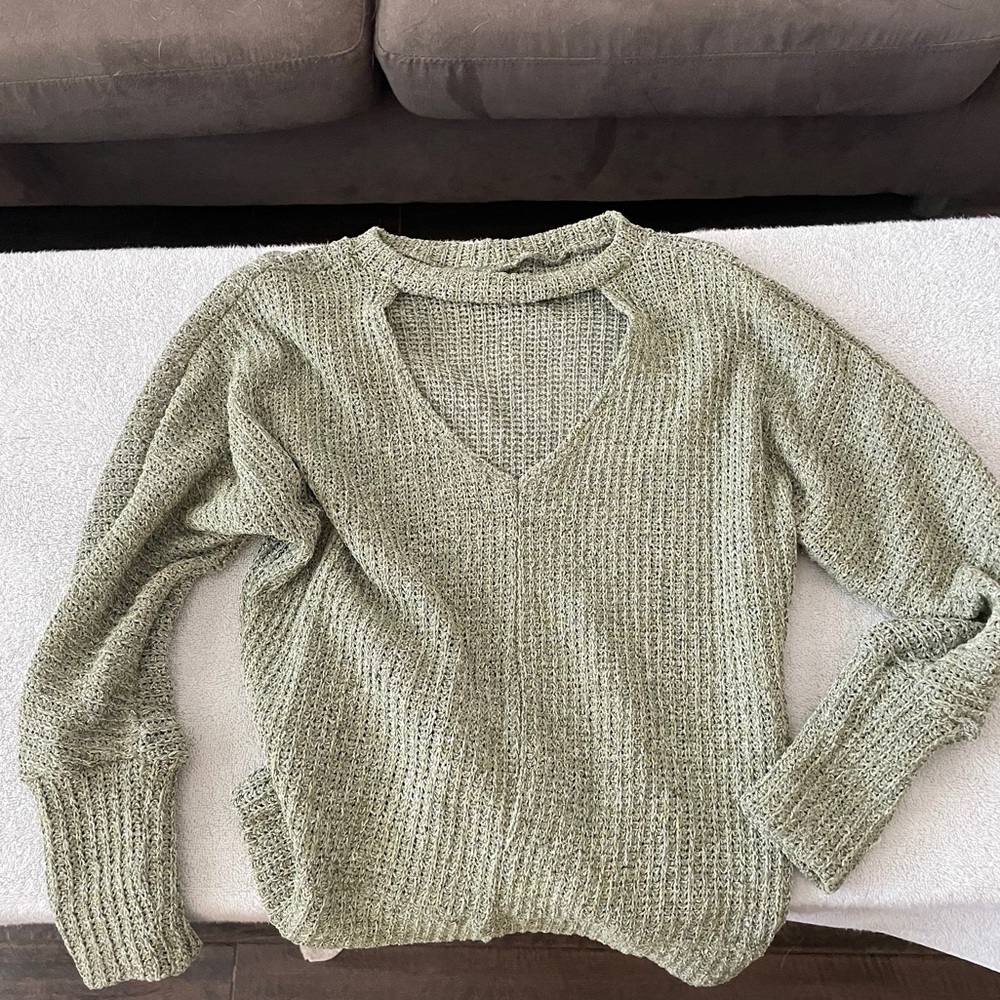 Green sweater with front opening.